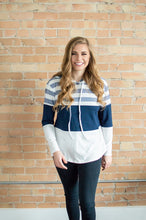 Load image into Gallery viewer, Model walking wearing striped hoodie.